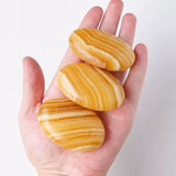 Orange calcite palmstone