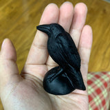 Obsidian crow carving